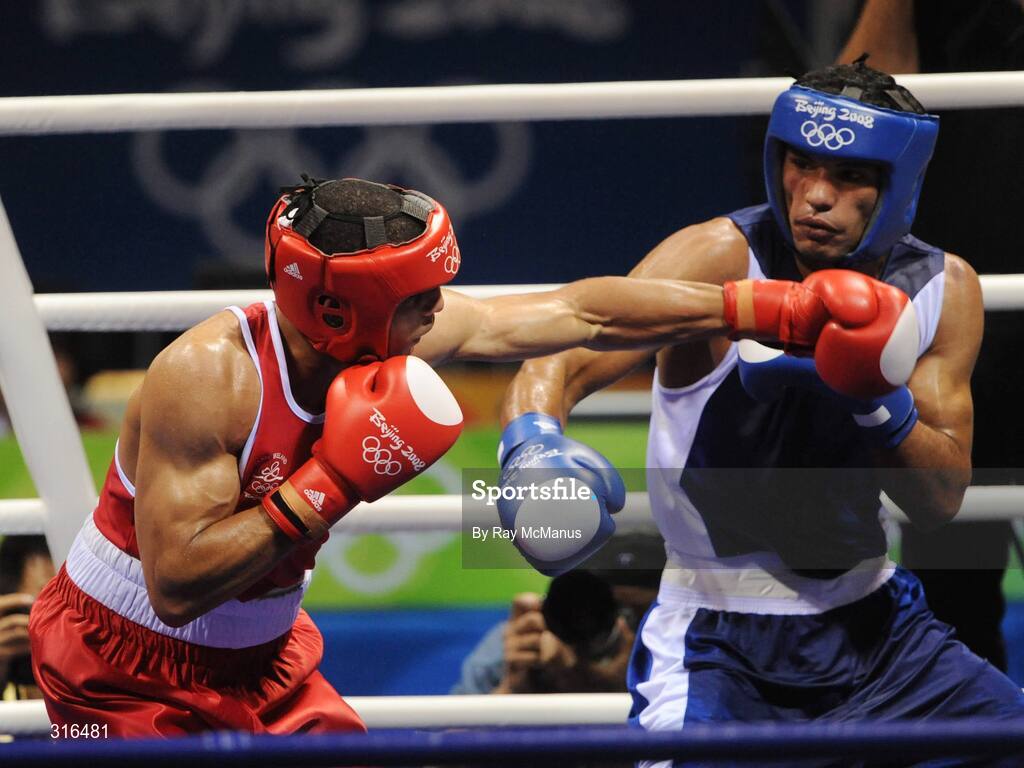 16 August 2008; Darren Sutherland, Ireland, in action against Nabil Kassel, from Algeria, during the 'round of 16' Middle weight, 75kg, contest. Beijing 2008 - Games of the XXIX Olympiad, Beijing Workers Gymnasium, Olympic Green, Beijing, China. Picture credit: Ray McManus / SPORTSFILE