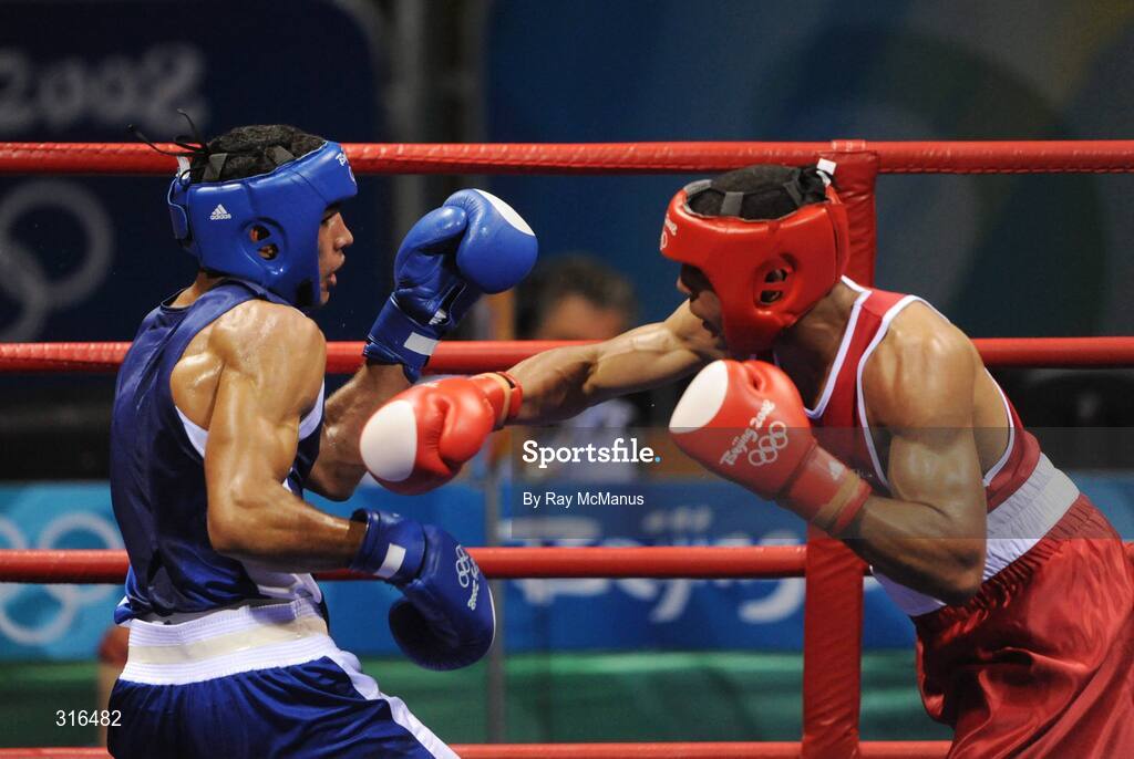 16 August 2008; Darren Sutherland, Ireland, in action against Nabil Kassel, from Algeria, during the 'round of 16' Middle weight, 75kg, contest. Beijing 2008 - Games of the XXIX Olympiad, Beijing Workers Gymnasium, Olympic Green, Beijing, China. Picture credit: Ray McManus / SPORTSFILE