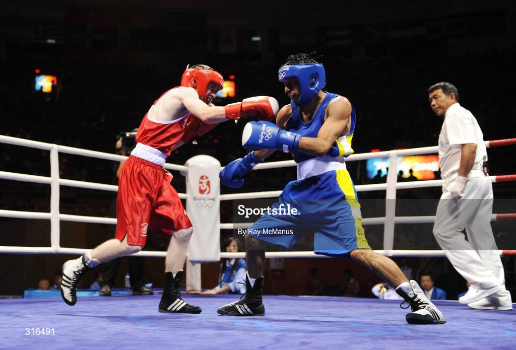 16 August 2008; Paddy Barnes, Ireland, in action against Jose Luis Meza, from Ecuador, during the 'round of 16' Light Fly weight, 48kg, contest. Beijing 2008 - Games of the XXIX Olympiad, Beijing Workers Gymnasium, Olympic Green, Beijing, China. Picture credit: Ray McManus / SPORTSFILE