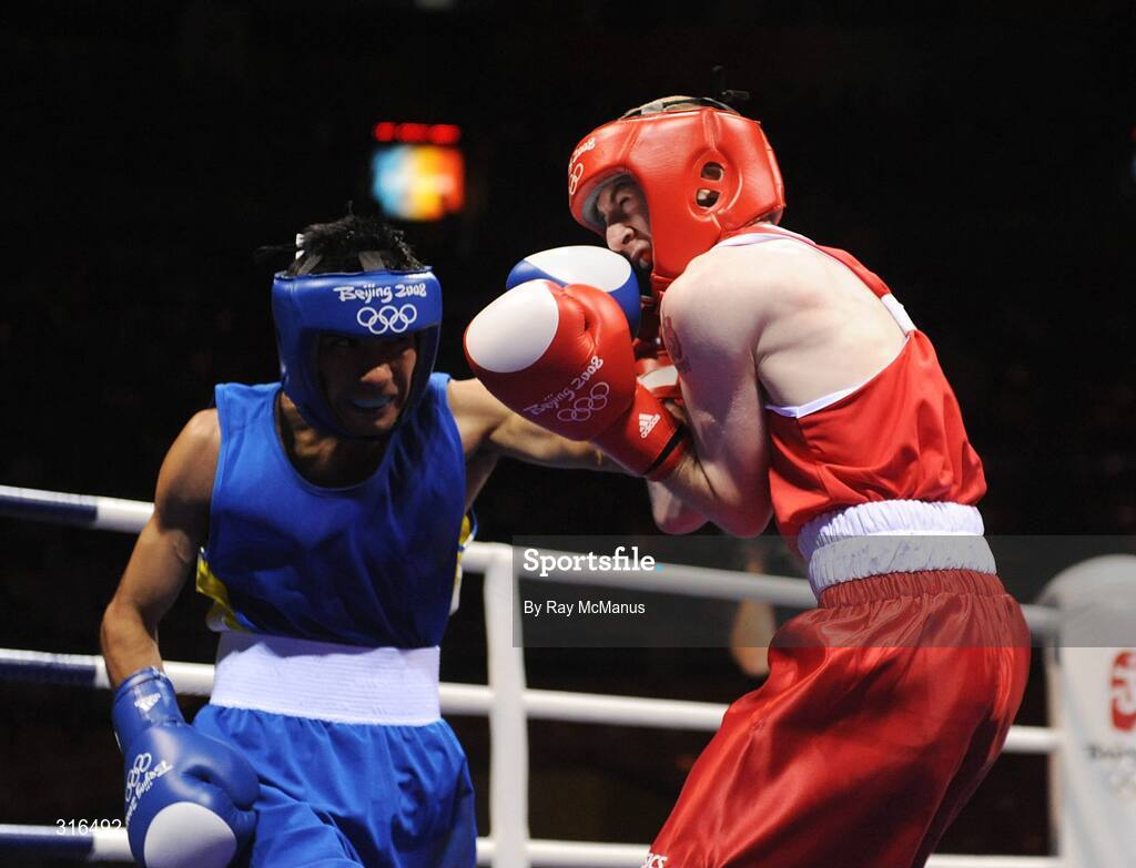 16 August 2008; Paddy Barnes, Ireland, in action against Jose Luis Meza, from Ecuador, during the 'round of 16' Light Fly weight, 48kg, contest. Beijing 2008 - Games of the XXIX Olympiad, Beijing Workers Gymnasium, Olympic Green, Beijing, China. Picture credit: Ray McManus / SPORTSFILE
