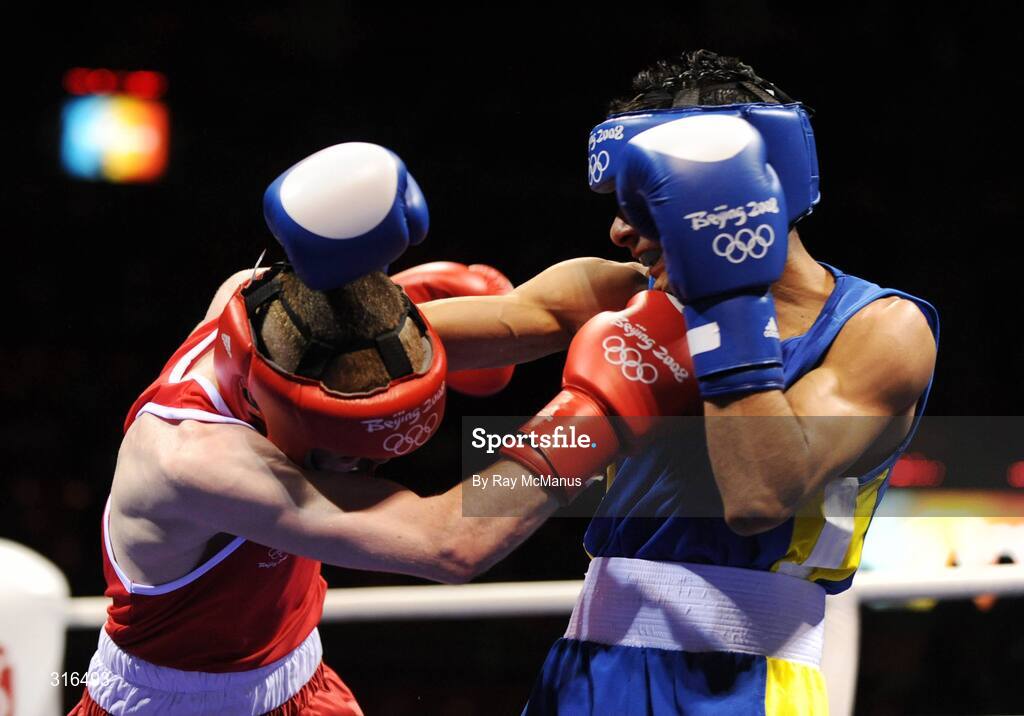 16 August 2008; Paddy Barnes, Ireland, in action against Jose Luis Meza, from Ecuador, during the 'round of 16' Light Fly weight, 48kg, contest. Beijing 2008 - Games of the XXIX Olympiad, Beijing Workers Gymnasium, Olympic Green, Beijing, China. Picture credit: Ray McManus / SPORTSFILE