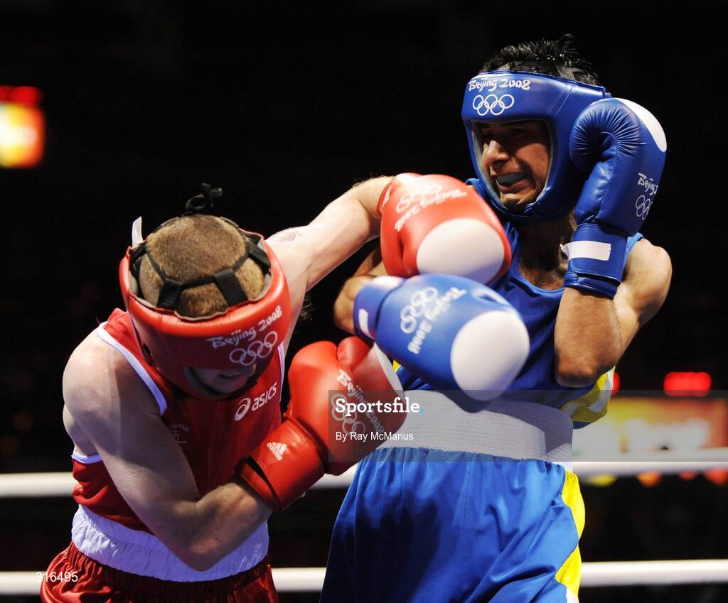 16 August 2008; Paddy Barnes, Ireland, in action against Jose Luis Meza, from Ecuador, during the 'round of 16' Light Fly weight, 48kg, contest. Beijing 2008 - Games of the XXIX Olympiad, Beijing Workers Gymnasium, Olympic Green, Beijing, China. Picture credit: Ray McManus / SPORTSFILE