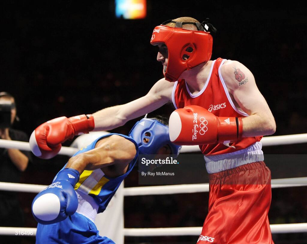 16 August 2008; Paddy Barnes, Ireland, in action against Jose Luis Meza, from Ecuador, during the 'round of 16' Light Fly weight, 48kg, contest. Beijing 2008 - Games of the XXIX Olympiad, Beijing Workers Gymnasium, Olympic Green, Beijing, China. Picture credit: Ray McManus / SPORTSFILE