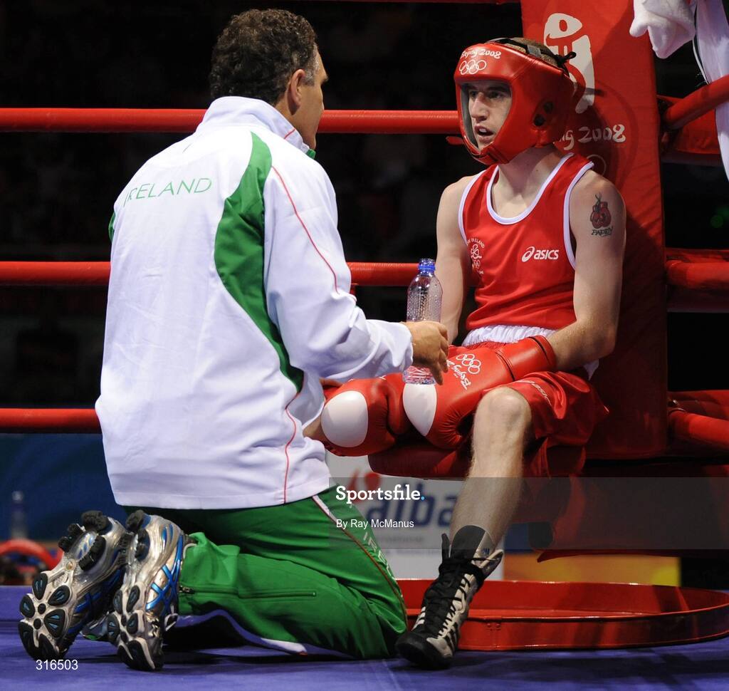 16 August 2008; Coach Billy Walsh speaks to Paddy Barnes, Ireland, during his bout with Jose Luis Meza, Ecuador, in the 'round of 16' Light Fly weight, 48kg, contest. Beijing 2008 - Games of the XXIX Olympiad, Beijing Workers Gymnasium, Olympic Green, Beijing, China. Picture credit: Ray McManus / SPORTSFILE