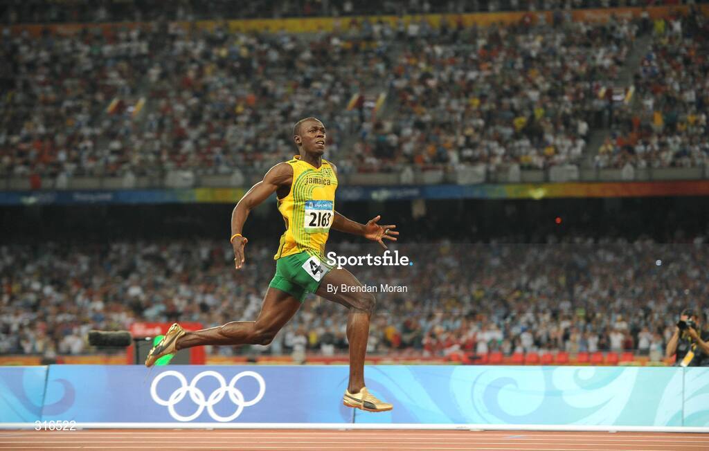 16 August 2008; Usain Bolt of Jamaica on his way to victory in the Men's 100m Final in a world record time of 9.69 seconds. Beijing 2008 - Games of the XXIX Olympiad, National Stadium, Olympic Green, Beijing, China. Picture credit: Brendan Moran / SPORTSFILE
