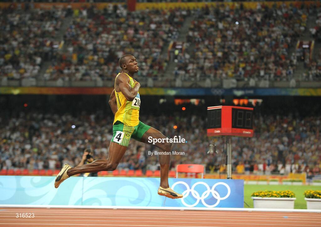 16 August 2008; Usain Bolt of Jamaica celebrates winning the Men's 100m Final in a world record time of 9.69 seconds. Beijing 2008 - Games of the XXIX Olympiad, National Stadium, Olympic Green, Beijing, China. Picture credit: Brendan Moran / SPORTSFILE