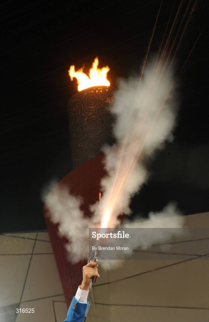 16 August 2008; The starter's gun goes off in front of the Olympic Torch in the National Stadium. Beijing 2008 - Games of the XXIX Olympiad, National Stadium, Olympic Green, Beijing, China. Picture credit: Brendan Moran / SPORTSFILE