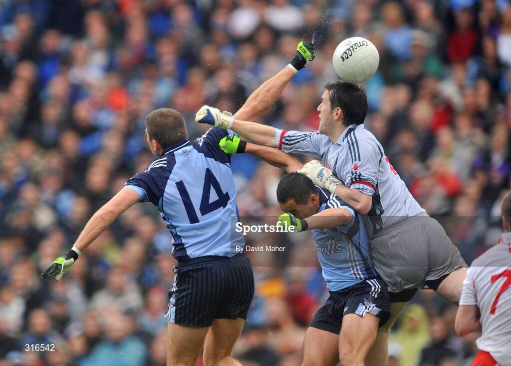16 August 2008; Conal Keaney, 14, Dublin, beats Tyrone goalkeeper John Devine, to score his side's first goal. GAA Football All-Ireland Senior Championship Quarter-Final, Dublin v Tyrone, Croke Park, Dublin. Picture credit: David Maher / SPORTSFILE