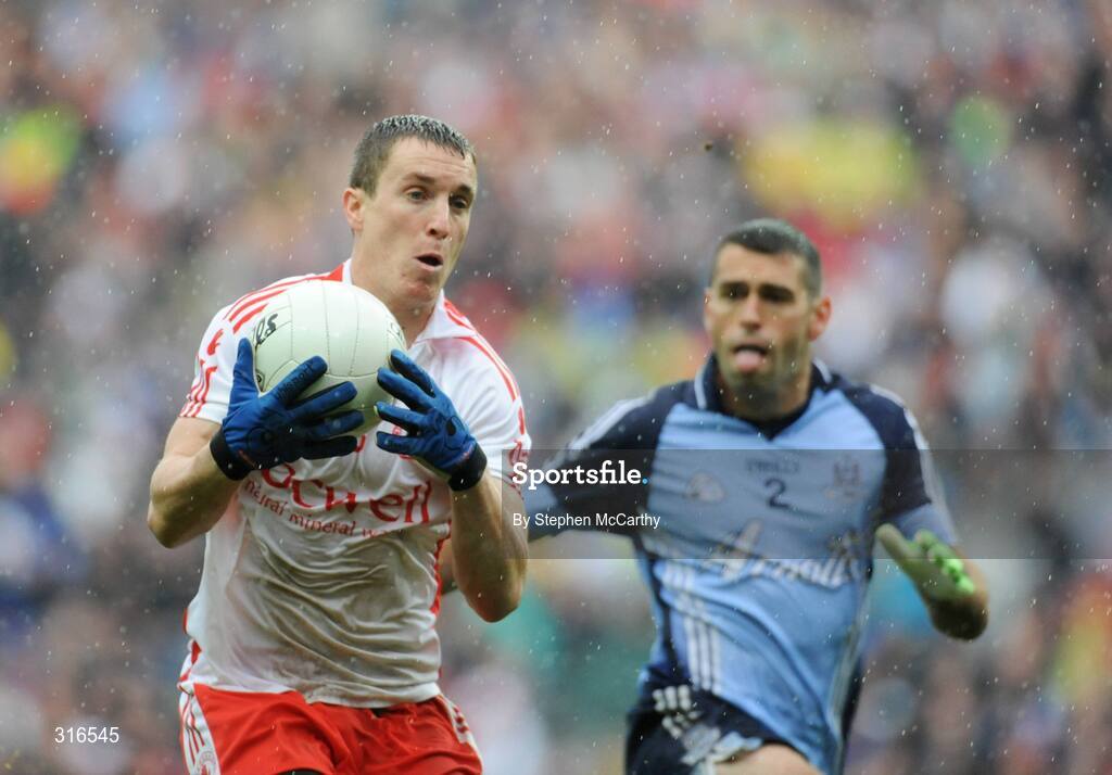 16 August 2008; Tommy McGuigan, Tyrone, in action against David Henry, Dublin. GAA Football All-Ireland Senior Championship Quarter-Final, Dublin v Tyrone, Croke Park, Dublin. Picture credit: Stephen McCarthy / SPORTSFILE
