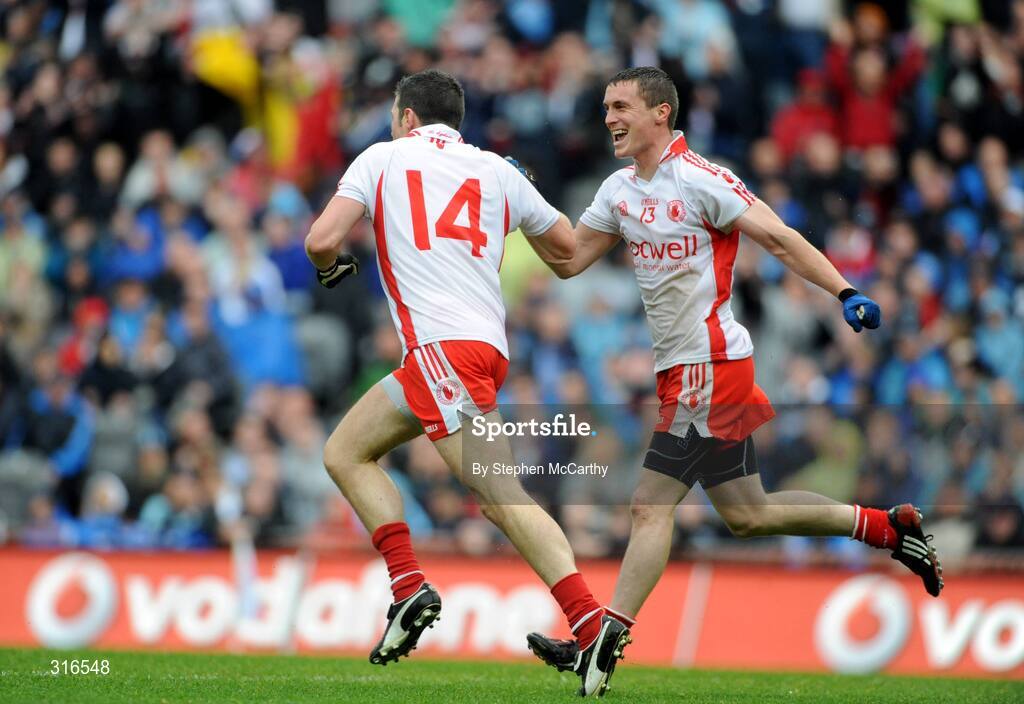 16 August 2008; Sean Cavanagh, 14, Tyrone, celebrates with Tommy McGuigan after scoring his side's first goal. GAA Football All-Ireland Senior Championship Quarter-Final, Dublin v Tyrone, Croke Park, Dublin. Picture credit: Stephen McCarthy / SPORTSFILE