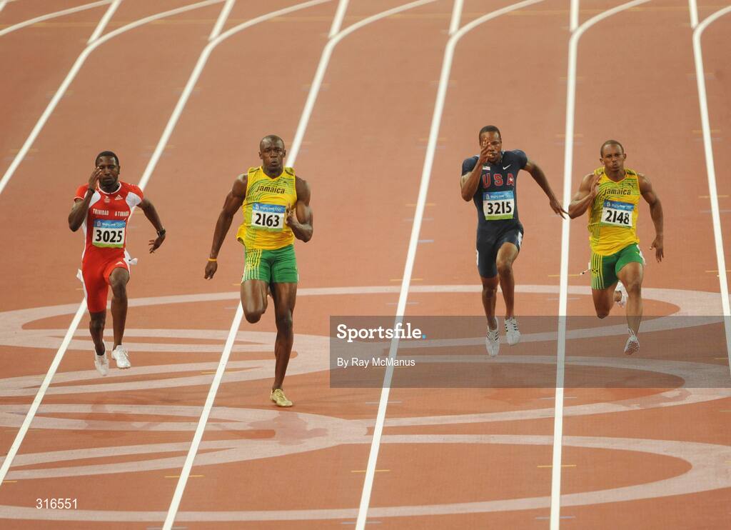16 August 2008; Usain Bolt, of Jamaica, 2163, races clear of Richard Thompson, Trinidad and Tobago, 3025, and Darvis Patton, USA, on his way to victory in the Men's 100m Final in a world record time of 9.69 seconds. Beijing 2008 - Games of the XXIX Olympiad, National Stadium, Olympic Green, Beijing, China. Picture credit: Ray McManus / SPORTSFILE