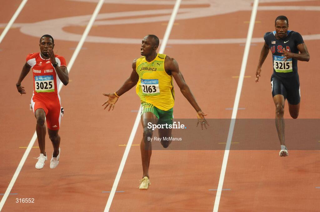 16 August 2008; Usain Bolt, of Jamaica, races clear of Richard Thompson, Trinidad and Tobago, and the field on his way to victory in the Men's 100m Final in a world record time of 9.69 seconds. Beijing 2008 - Games of the XXIX Olympiad, National Stadium, Olympic Green, Beijing, China. Picture credit: Ray McManus / SPORTSFILE