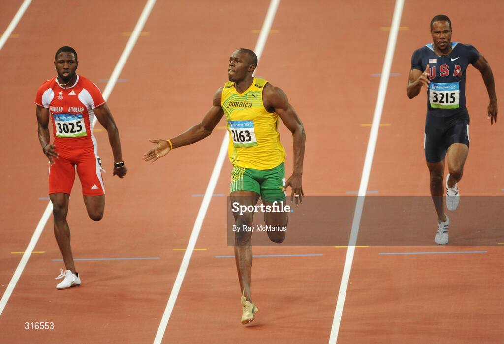 16 August 2008; Usain Bolt, of Jamaica, 2163, races clear of Richard Thompson, Trinidad and Tobago, 3025, and Darvis Patton, USA, on his way to victory in the Men's 100m Final in a world record time of 9.69 seconds. Beijing 2008 - Games of the XXIX Olympiad, National Stadium, Olympic Green, Beijing, China. Picture credit: Ray McManus / SPORTSFILE