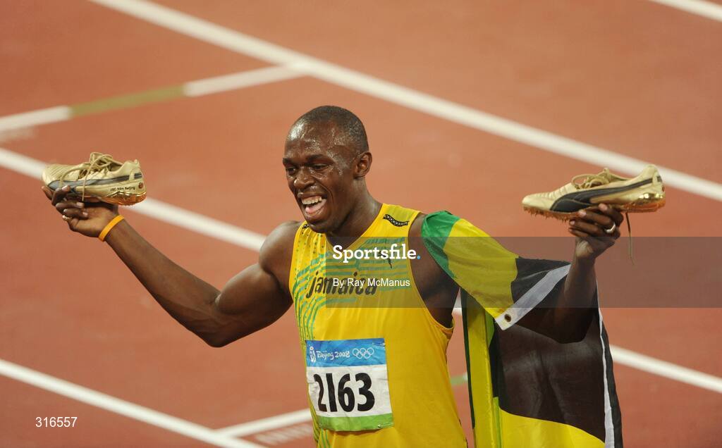 16 August 2008; Usain Bolt, of Jamaica, celebrates with a lap of honour after winning the Men's 100m Final in a world record time of 9.69 seconds. Beijing 2008 - Games of the XXIX Olympiad, National Stadium, Olympic Green, Beijing, China. Picture credit: Ray McManus / SPORTSFILE