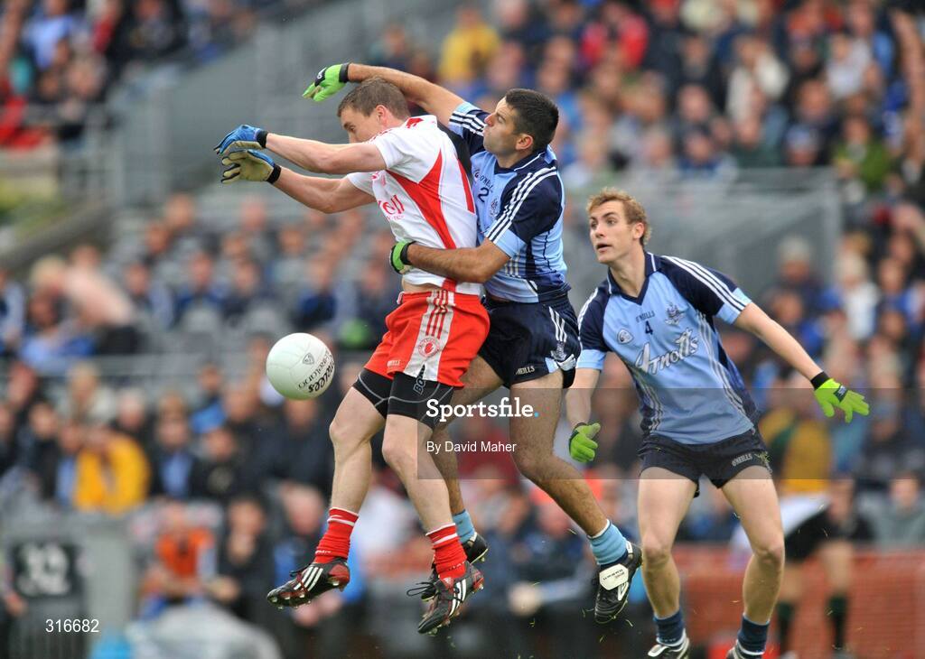 16 August 2008; Tommy McGuigan, Tyrone, in action against David Henry, Dublin. GAA Football All-Ireland Senior Championship Quarter-Final, Dublin v Tyrone, Croke Park, Dublin. Picture credit: David Maher / SPORTSFILE