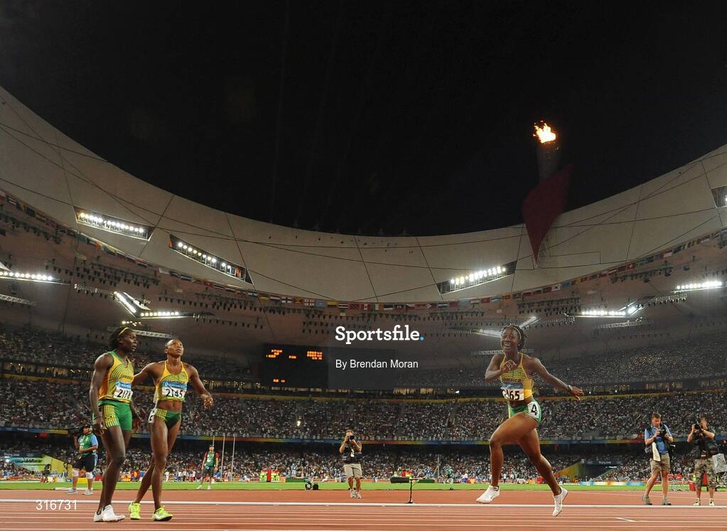 17 August 2008; Shelly Ann Fraser, 2165, of Jamaica, celebrates winning the Women's 100m Final in a time of 10.78 seconds. Also in picture are joint second placed Sherone Simpson, 2145, and Kerron Stewart, 2148, both of Jamaica also. Beijing 2008 - Games of the XXIX Olympiad, National Stadium, Olympic Green, Beijing, China. Picture credit: Brendan Moran / SPORTSFILE