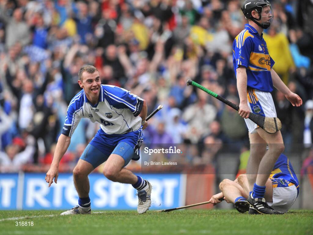 17 August 2008; Waterford's Eoin Kelly celebrates after scoring his side's first goal as Tipperary's Eamonn Buckley looks on. GAA Hurling All-Ireland Senior Championship Semi-Final, Tipperary v Waterford, Croke Park, Dublin. Picture credit: Brian Lawless / SPORTSFILE