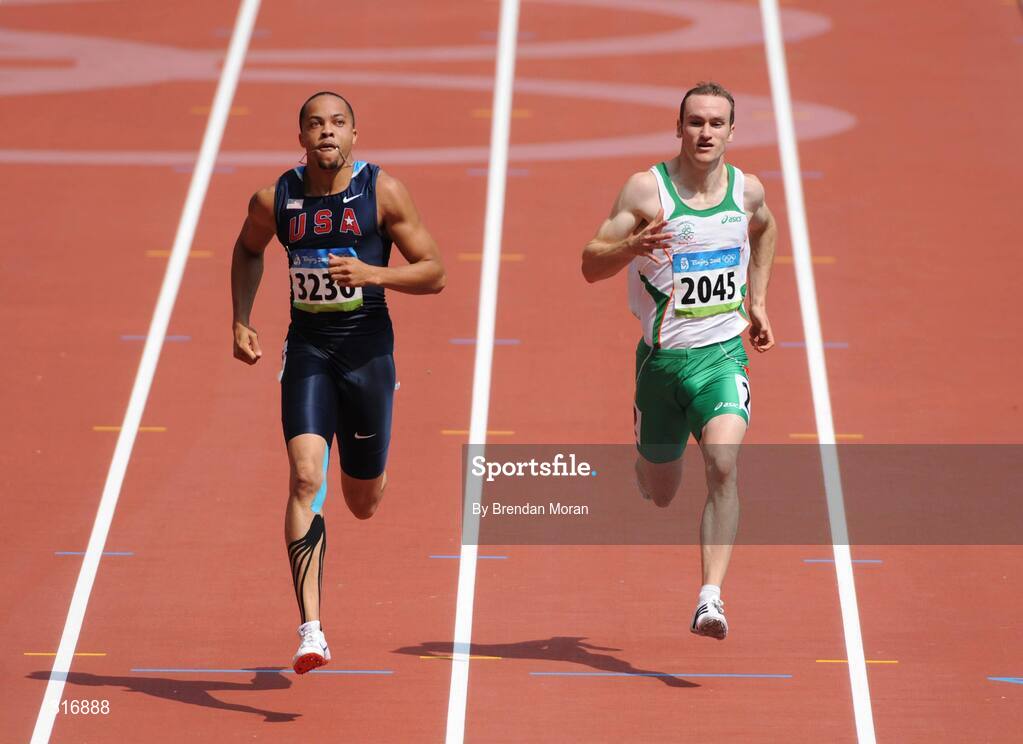 18 August 2008; Paul Hession, 2045, Ireland, alongside Wallace Spearmon, 3236, of the USA, during the Round 1 heats of the Men's 400m heats, where he finished 3rd in a time of 20.59 and progressed to Round 2. Beijing 2008 - Games of the XXIX Olympiad, National Stadium, Olympic Green, Beijing, China. Picture credit: Brendan Moran / SPORTSFILE