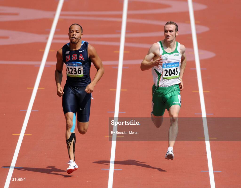 18 August 2008; Paul Hession, 2045, Ireland, looks across towards Wallace Spearmon, 3236, of the USA, during the Round 1 heats of the Men's 400m heats, where he finished 3rd in a time of 20.59 and progressed to Round 2. Beijing 2008 - Games of the XXIX Olympiad, National Stadium, Olympic Green, Beijing, China. Picture credit: Brendan Moran / SPORTSFILE