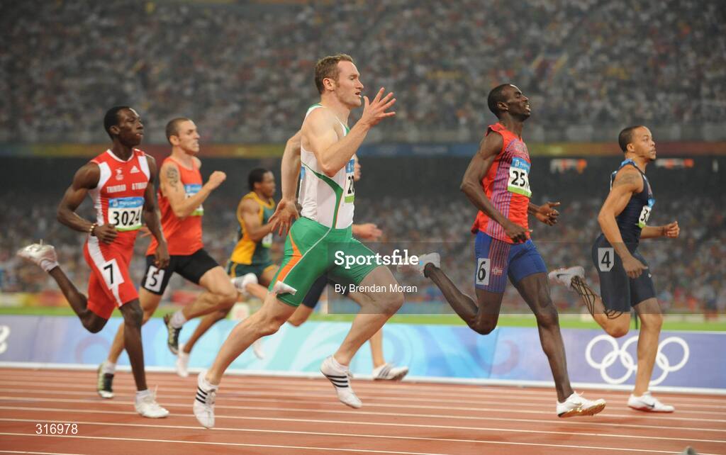 18 August 2008; Paul Hession, Ireland, on his way to winning his Round 2 heat of the Men's 200m, ahead of Wallace Spearmon, right, of the USA, and Jaysuma Saidy Ndure, centre, of Norway. He posted a season best time of 20.32 and qualified for the semi-finals. Beijing 2008 - Games of the XXIX Olympiad, National Stadium, Olympic Green, Beijing, China. Picture credit: Brendan Moran / SPORTSFILE
