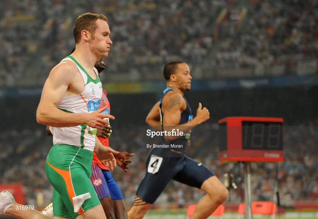 18 August 2008; Paul Hession, Ireland, on his way to winning his Round 2 heat of the Men's 200m, ahead of Wallace Spearmon, right, of the USA. He posted a season best time of 20.32 and qualified for the semi-finals. Beijing 2008 - Games of the XXIX Olympiad, National Stadium, Olympic Green, Beijing, China. Picture credit: Brendan Moran / SPORTSFILE
