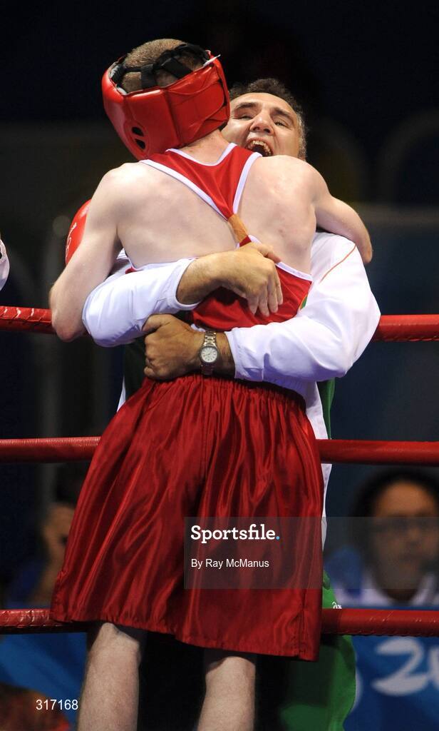 19 August 2008; Ireland's Paddy Barnes celebrates victory, in the quarter-final bout of the Light Fly weight, 48kg, contest, over Lukasz Maszczyk, from Poland, with head coach Billy Walsh. Beijing 2008 - Games of the XXIX Olympiad, Beijing Workers Gymnasium, Olympic Green, Beijing, China. Picture credit: Ray McManus / SPORTSFILE