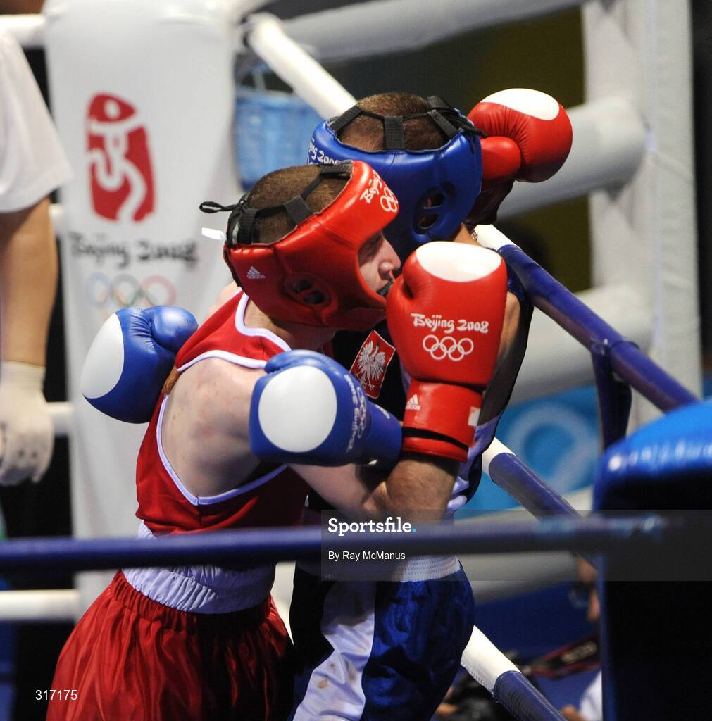 19 August 2008; Paddy Barnes, Ireland, pins Lukasz Maszczyk, from Poland, to the ropes in the last round during their quarter-final bout of the Light Fly weight, 48kg, contest. Beijing 2008 - Games of the XXIX Olympiad, Beijing Workers Gymnasium, Olympic Green, Beijing, China. Picture credit: Ray McManus / SPORTSFILE