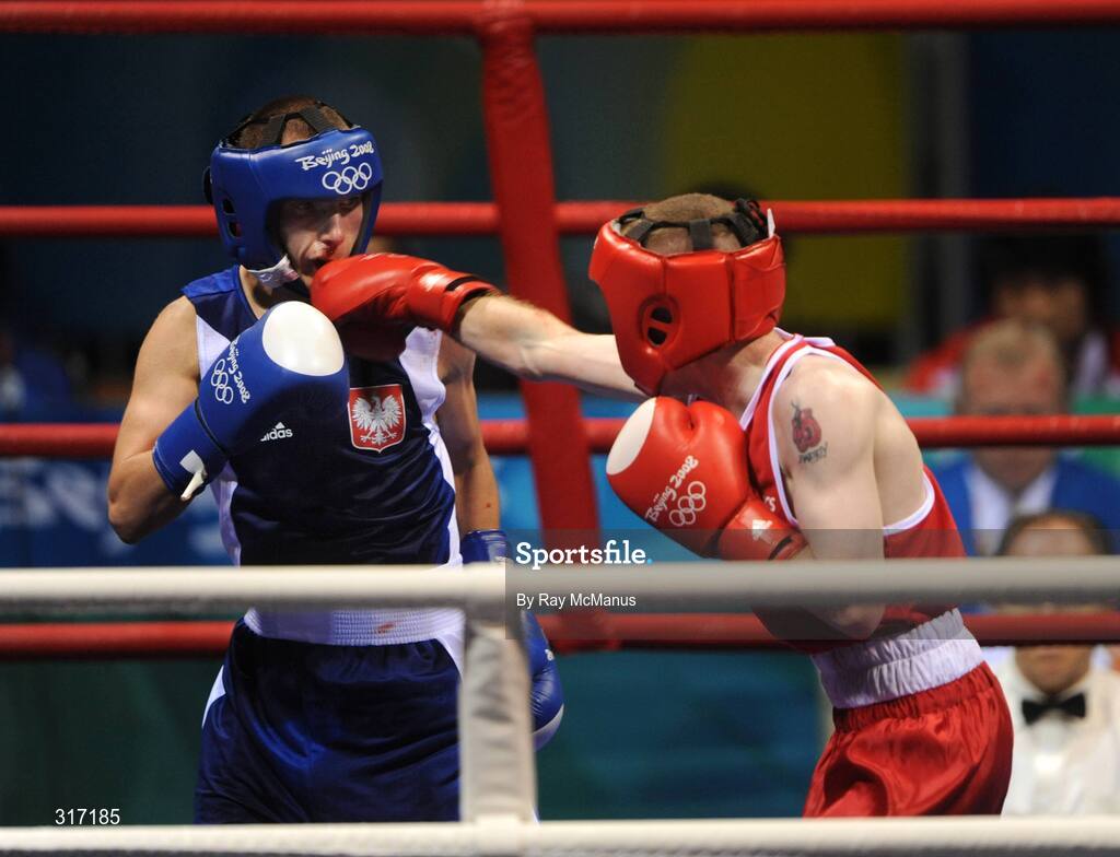 19 August 2008; Paddy Barnes, Ireland, scores his 9th point against Lukasz Maszczyk, from Poland, during their quarter-final bout of the Light Fly weight, 48kg, contest. Beijing 2008 - Games of the XXIX Olympiad, Beijing Workers Gymnasium, Olympic Green, Beijing, China. Picture credit: Ray McManus / SPORTSFILE
