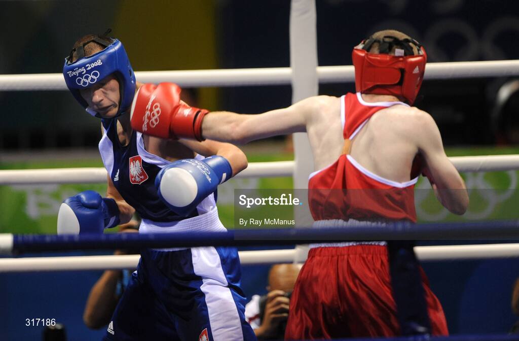 19 August 2008; Paddy Barnes, Ireland, in action against Lukasz Maszczyk, in blue from Poland, during their quarter-final bout of the Light Fly weight, 48kg, contest. Beijing 2008 - Games of the XXIX Olympiad, Beijing Workers Gymnasium, Olympic Green, Beijing, China. Picture credit: Ray McManus / SPORTSFILE