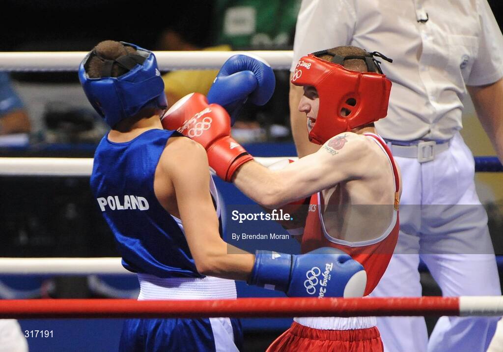 19 August 2008; Paddy Barnes, Ireland, in action against Lukasz Maszczyk, in blue, Poland, during their quarter-final bout in the Light Fly weight, 48kg, contest. Beijing 2008 - Games of the XXIX Olympiad, Beijing Workers' Gymnasium, Olympic Green, Beijing, China. Picture credit: Brendan Moran / SPORTSFILE