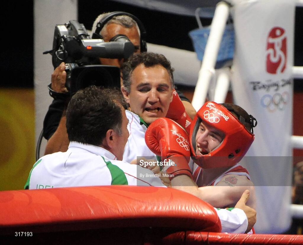 19 August 2008; Paddy Barnes, Ireland, celebrates with coaches Billy Walsh and Zaur Antia after his victory over Lukasz Maszczyk, Poland, after their quarter-final bout in the Light Fly weight, 48kg, contest. Beijing 2008 - Games of the XXIX Olympiad, Beijing Workers' Gymnasium, Olympic Green, Beijing, China. Picture credit: Brendan Moran / SPORTSFILE