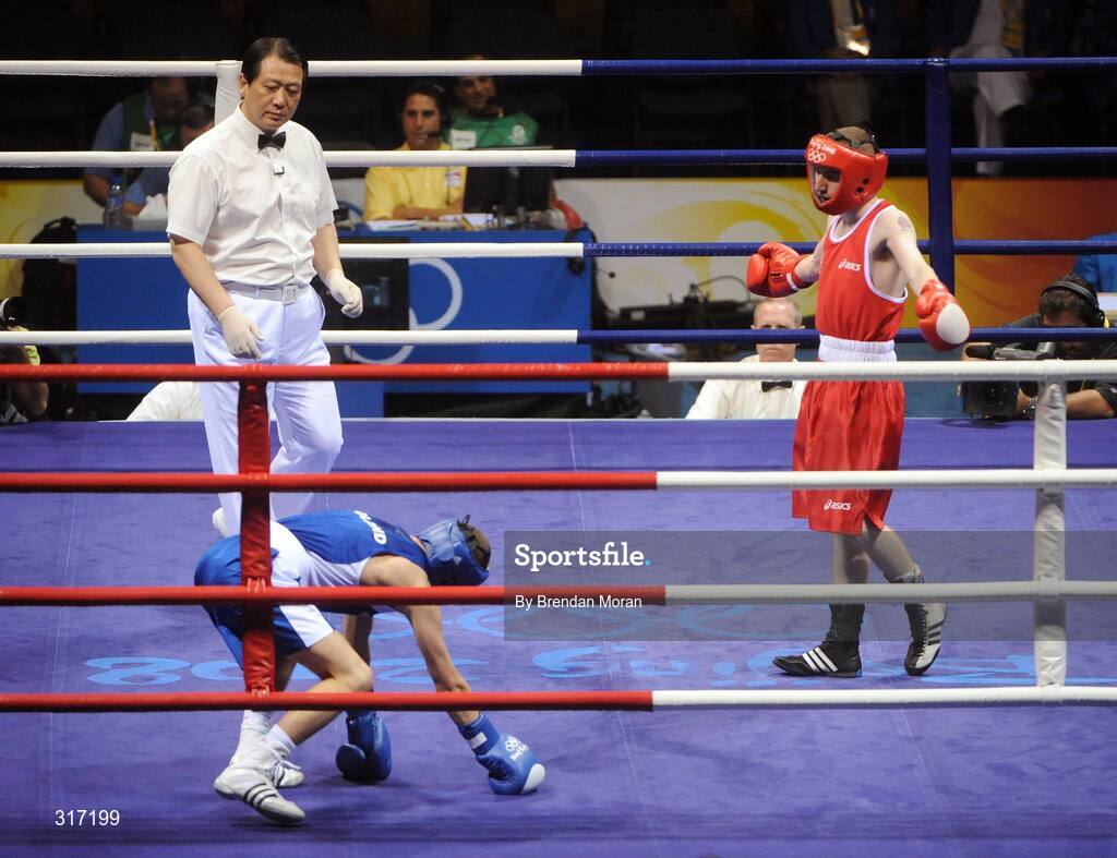 19 August 2008; Lukasz Maszczyk, in blue, Poland, goes down watched by Paddy Barnes, Ireland, during their quarter-final bout in the Light Fly weight, 48kg, contest. Beijing 2008 - Games of the XXIX Olympiad, Beijing Workers' Gymnasium, Olympic Green, Beijing, China. Picture credit: Brendan Moran / SPORTSFILE