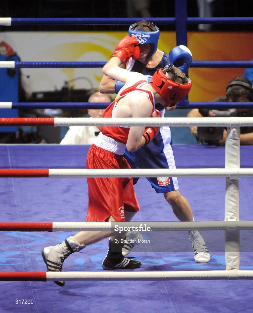19 August 2008; Paddy Barnes, Ireland, lands a punch on Lukasz Maszczyk, in blue, Poland, during round 2 of their quarter-final bout in the Light Fly weight, 48kg, contest. Beijing 2008 - Games of the XXIX Olympiad, Beijing Workers' Gymnasium, Olympic Green, Beijing, China. Picture credit: Brendan Moran / SPORTSFILE