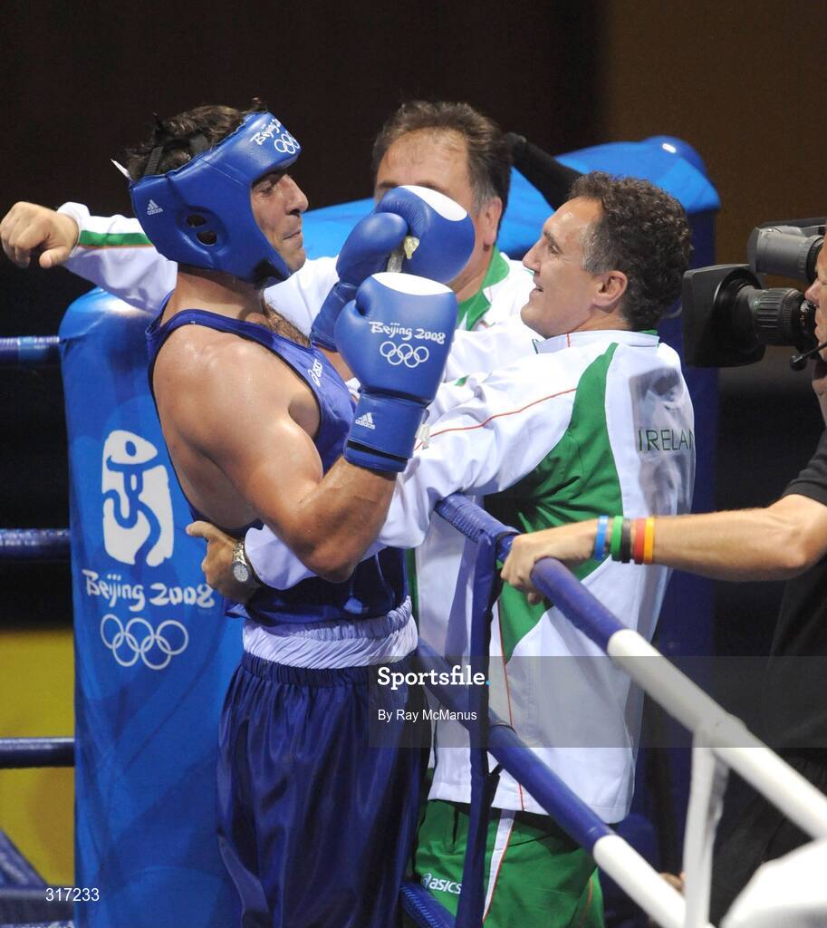 19 August 2008; Kenny Egan, Ireland, celebrates with coach Billy Walsh after defeating Washington Silva, from Brazil, after their quarter-final bout of the Light Heavy weight, 81kg, contest. Beijing 2008 - Games of the XXIX Olympiad, Beijing Workers Gymnasium, Olympic Green, Beijing, China. Picture credit: Ray McManus / SPORTSFILE