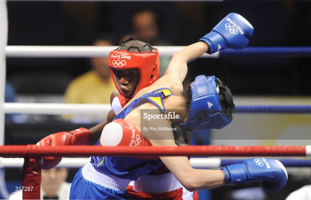 19 August 2008; Daouda Sow, France, in action against Qing Hu, in blue from China, during their quarter-final bout of the Light weight, 60kg, contest. Beijing 2008 - Games of the XXIX Olympiad, Beijing Workers Gymnasium, Olympic Green, Beijing, China. Picture credit: Ray McManus / SPORTSFILE