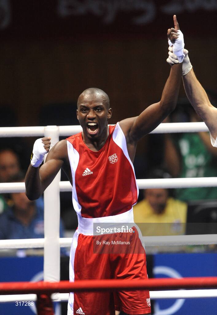19 August 2008; Daouda Sow, France, celebrates his victory over Qing Hu, from China, after their quarter-final bout of the Light weight, 60kg, contest. Beijing 2008 - Games of the XXIX Olympiad, Beijing Workers Gymnasium, Olympic Green, Beijing, China. Picture credit: Ray McManus / SPORTSFILE