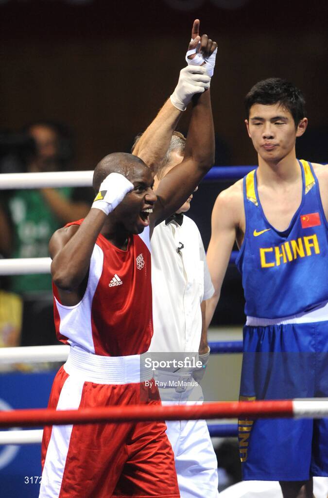 19 August 2008; Daouda Sow, France, celebrates his victory over Qing Hu, from China, after their quarter-final bout of the Light weight, 60kg, contest. Beijing 2008 - Games of the XXIX Olympiad, Beijing Workers Gymnasium, Olympic Green, Beijing, China. Picture credit: Ray McManus / SPORTSFILE