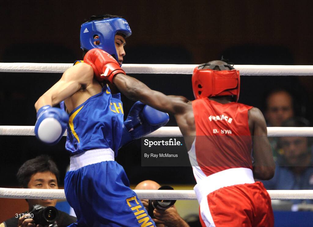 19 August 2008; Daouda Sow, France, in action against Qing Hu, in blue from China, during their quarter-final bout of the Light weight, 60kg, contest. Beijing 2008 - Games of the XXIX Olympiad, Beijing Workers Gymnasium, Olympic Green, Beijing, China. Picture credit: Ray McManus / SPORTSFILE