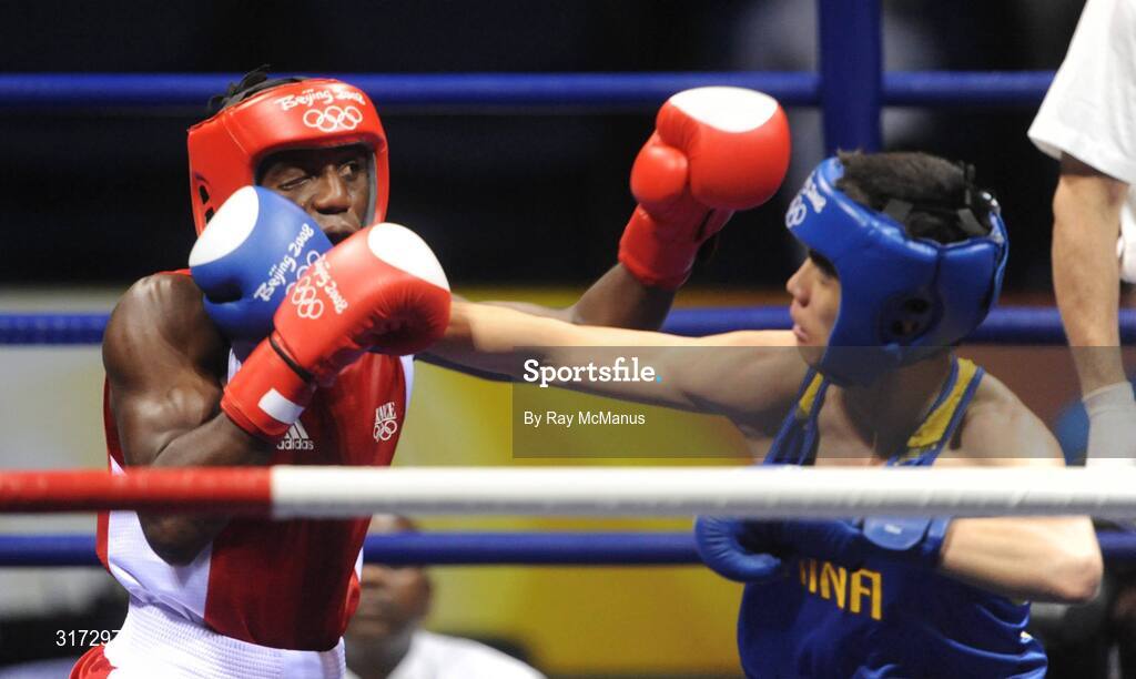 19 August 2008; Daouda Sow, France, in action against Qing Hu, in blue from China, during their quarter-final bout of the Light weight, 60kg, contest. Beijing 2008 - Games of the XXIX Olympiad, Beijing Workers Gymnasium, Olympic Green, Beijing, China. Picture credit: Ray McManus / SPORTSFILE