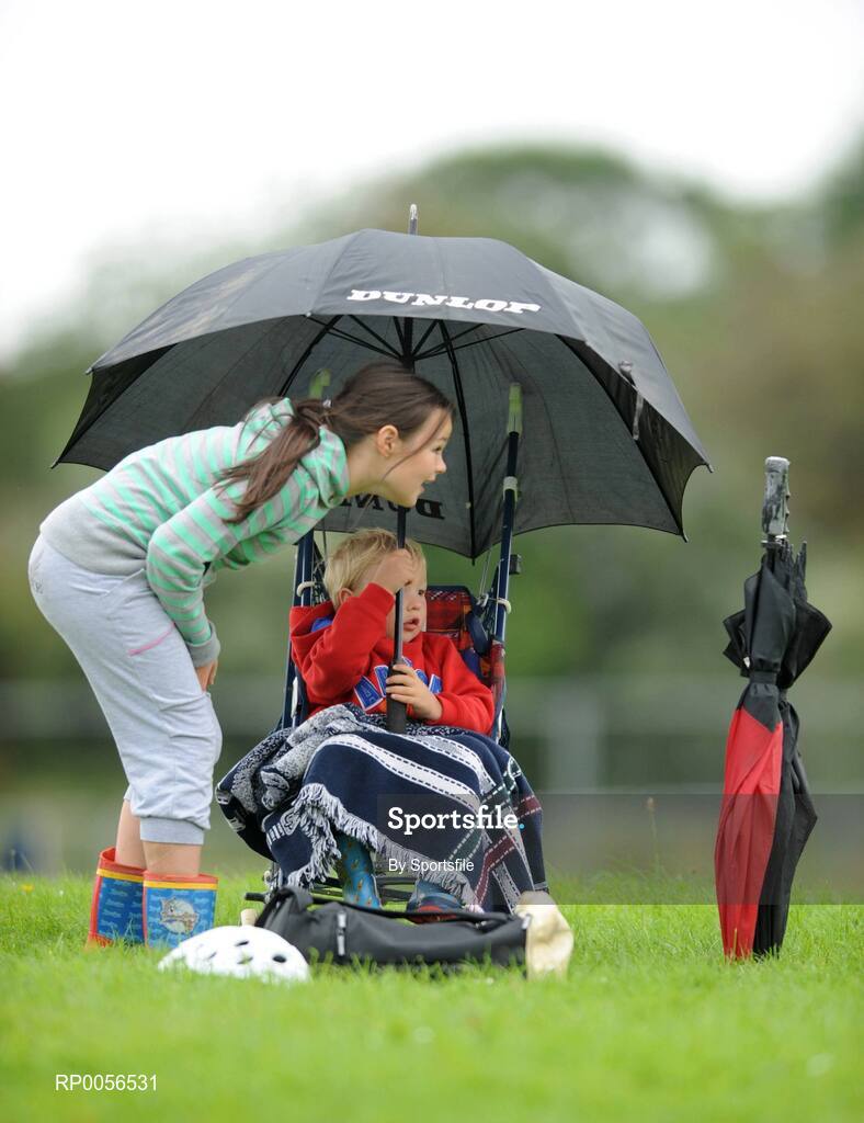 17 August 2008; The HSE Community Games National Finals kicked off in style this weekend as the Games celebrate 40 years of fun and achievement. Pictured at the HSE Community Games National Finals in Mosney is four year old Colm Dunne and his eight year old sister Niamh from Enniscourthy, Co. Wexford, taking shelter from the rain. This years finals, which will take place from 16th - 17th August and 23rd - 24th August, will see an estimated 6,500 young people aged between six and 16 years participate in a diverse range of activities such as athletics, football, basketball, art, model making and dancing. Photo by Sportsfile