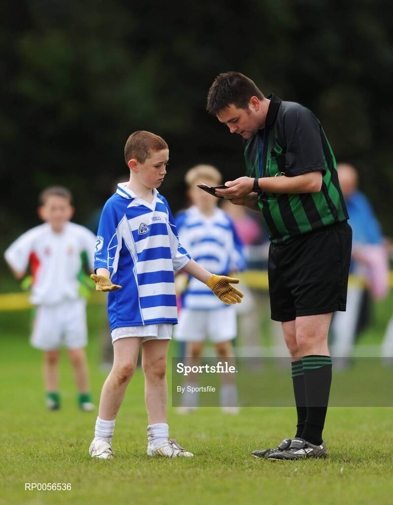 17 August 2008; The HSE Community Games National Finals kicked off in style this weekend as the Games celebrate 40 years of fun and achievement. Pictured at the HSE Community Games National Finals in Mosney is Sam Garvey, Naas West, Co. Kildare, pleading his innocence with referee Jason O'Dwyer in the Mixed Under 10 Gaelic Football Final against Ternonmaccuirrt, Co. Tyrone. This years finals, which will take place from 16th - 17th August and 23rd - 24th August, will see an estimated 6,500 young people aged between six and 16 years participate in a diverse range of activities such as athletics, football, basketball, art, model making and dancing. Photo by Sportsfile