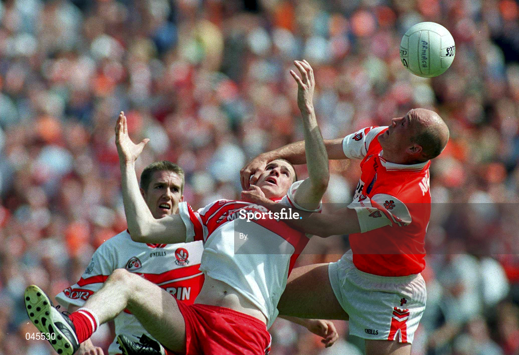 16 July 2000; Gerard Reid, Armagh in action against Enda Muldoon, Derry, Ulster Football Championship Final, Armagh v Derry, Clones, Co. Monaghan. Picture credit; Damien Eagers/SPORTSFILE