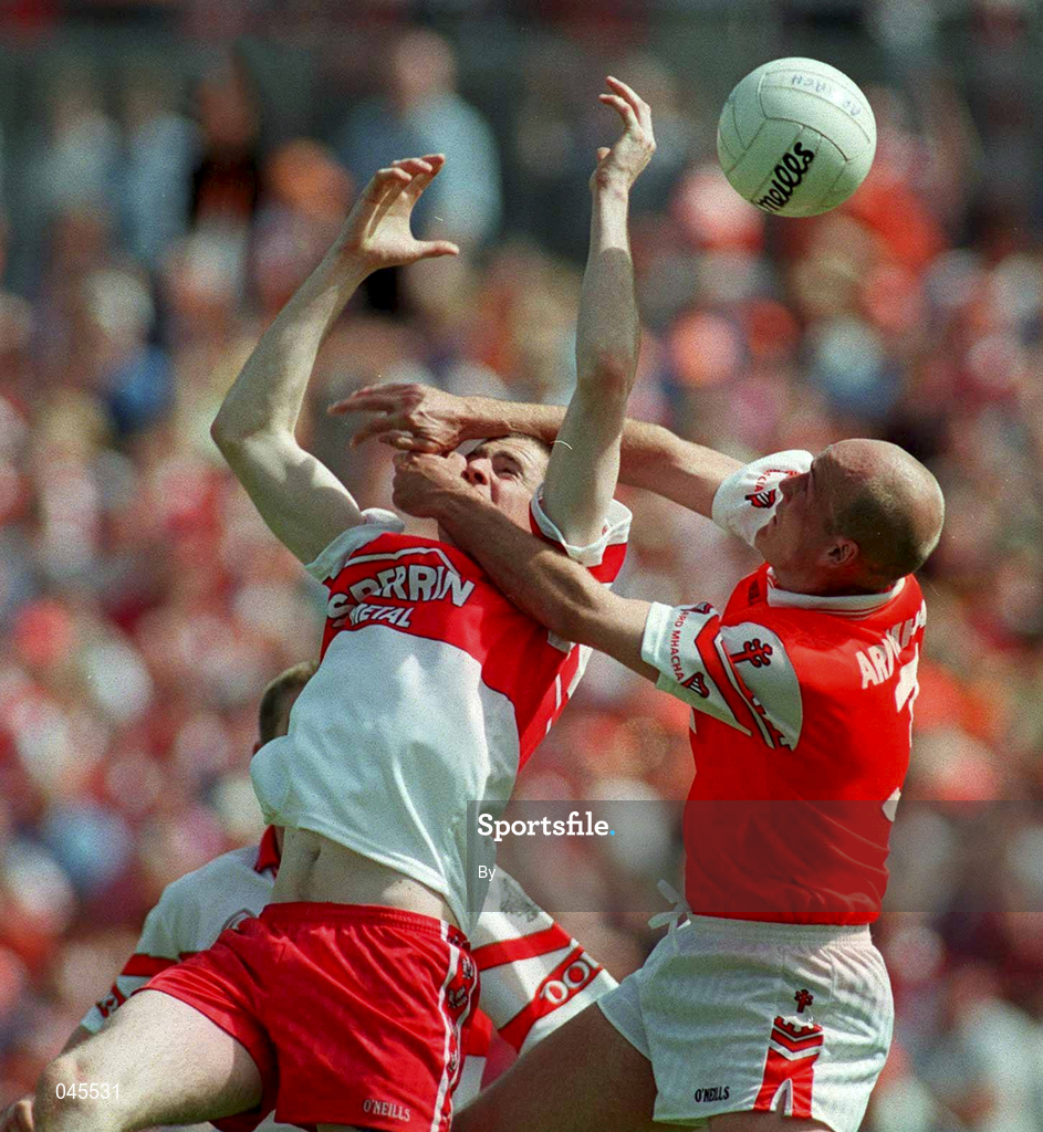 16 July 2000; Gerard Reid, Armagh, right, in action against Enda Muldoon, Derry, Ulster Football Championship Final, Armagh v Derry, Clones, Co. Monaghan. Picture credit; Damien Eagers/SPORTSFILE