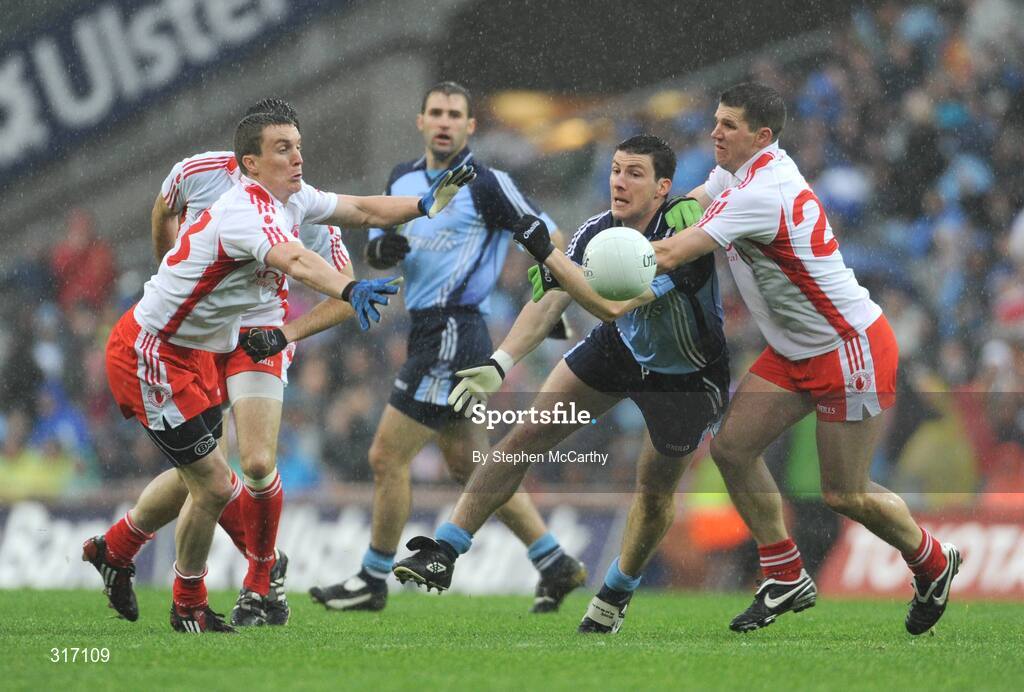 16 August 2008; Colin Moran, Dublin, gets the ball away despite the attention of Tommy McGuigan, left, and Colin Holmes, Tyrone. GAA Football All-Ireland Senior C'ship Quarter-Final, Dublin v Tyrone, Croke Park, Dublin. Picture credit: Stephen McCarthy / SPORTSFILE