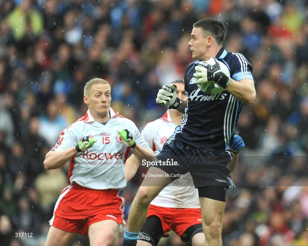 16 August 2008; Stephen Cluxton, Dublin, claims the ball ahead of Colm McCullagh, left, and Tommy McGuigan, Tyrone. GAA Football All-Ireland Senior C'ship Quarter-Final, Dublin v Tyrone, Croke Park, Dublin. Picture credit: Stephen McCarthy / SPORTSFILE