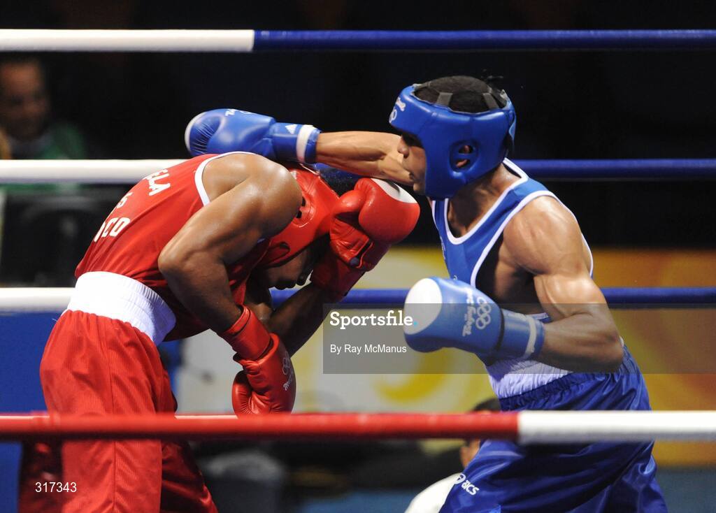 20 August 2008; Darren Sutherland, Ireland, in action against Alfonso Blanco Parra, in red from Venezuela, during their quarter-final bout of the Middle weight, 75kg, contest. Beijing 2008 - Games of the XXIX Olympiad, Beijing Workers Gymnasium, Olympic Green, Beijing, China. Picture credit: Ray McManus / SPORTSFILE