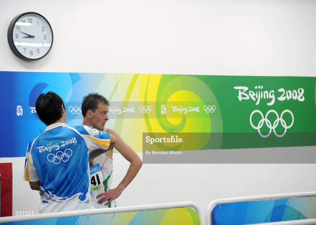 20 August 2008; Alistair Cragg, Ireland, has his race number taken by an official after his heat of the Men's 5000m, where he finished 6th in a time of 13:38.57 and qualified for the final. Beijing 2008 - Games of the XXIX Olympiad, National Stadium, Olympic Green, Beijing, China. Picture credit: Brendan Moran / SPORTSFILE