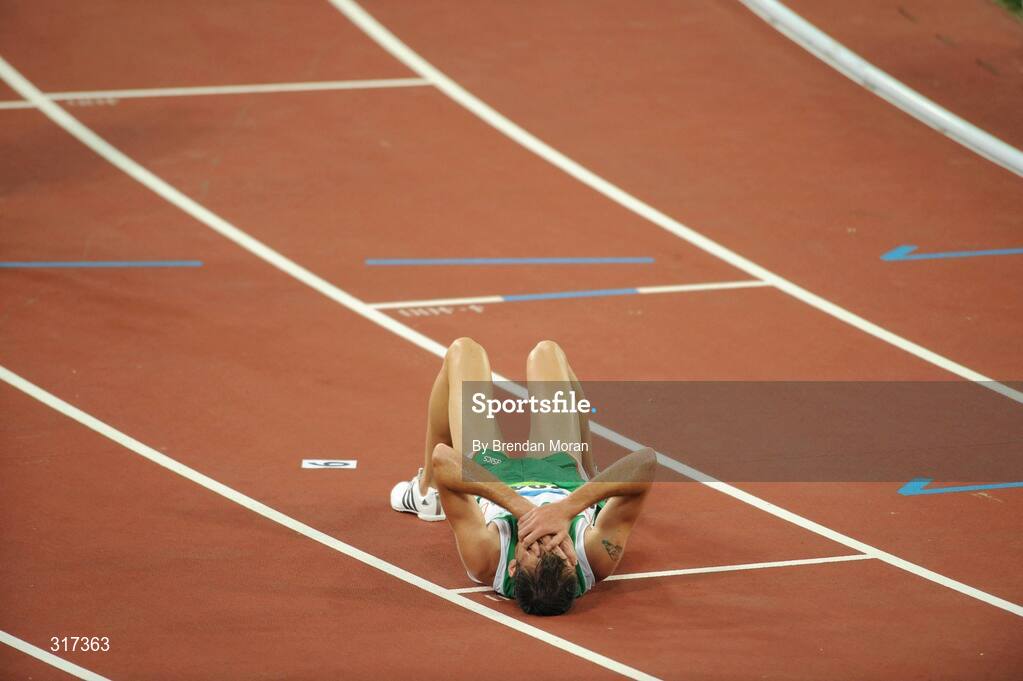 20 August 2008; Alistair Cragg, 2041, Ireland, lies on the track after his heat of the Men's 5000m, where he finished 6th in a time of 13:38.57 and qualified for the final. Beijing 2008 - Games of the XXIX Olympiad, National Stadium, Olympic Green, Beijing, China. Picture credit: Brendan Moran / SPORTSFILE
