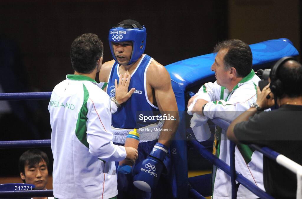 20 August 2008; Darren Sutherland, Ireland, is congratulated by head coach Billy Walsh and technical coach Zaur Antia after his victory over Alfonso Blanco Parra, from Venezuela, during their quarter-final bout of the Middle weight, 75kg, contest. Beijing 2008 - Games of the XXIX Olympiad, Beijing Workers Gymnasium, Olympic Green, Beijing, China. Picture credit: Ray McManus / SPORTSFILE