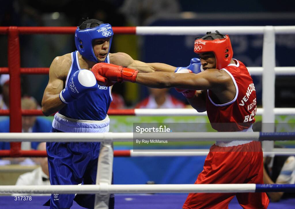 20 August 2008; Darren Sutherland, Ireland, in action against Alfonso Blanco Parra, in red from Venezuela, during their quarter-final bout of the Middle weight, 75kg, contest. Beijing 2008 - Games of the XXIX Olympiad, Beijing Workers Gymnasium, Olympic Green, Beijing, China. Picture credit: Ray McManus / SPORTSFILE